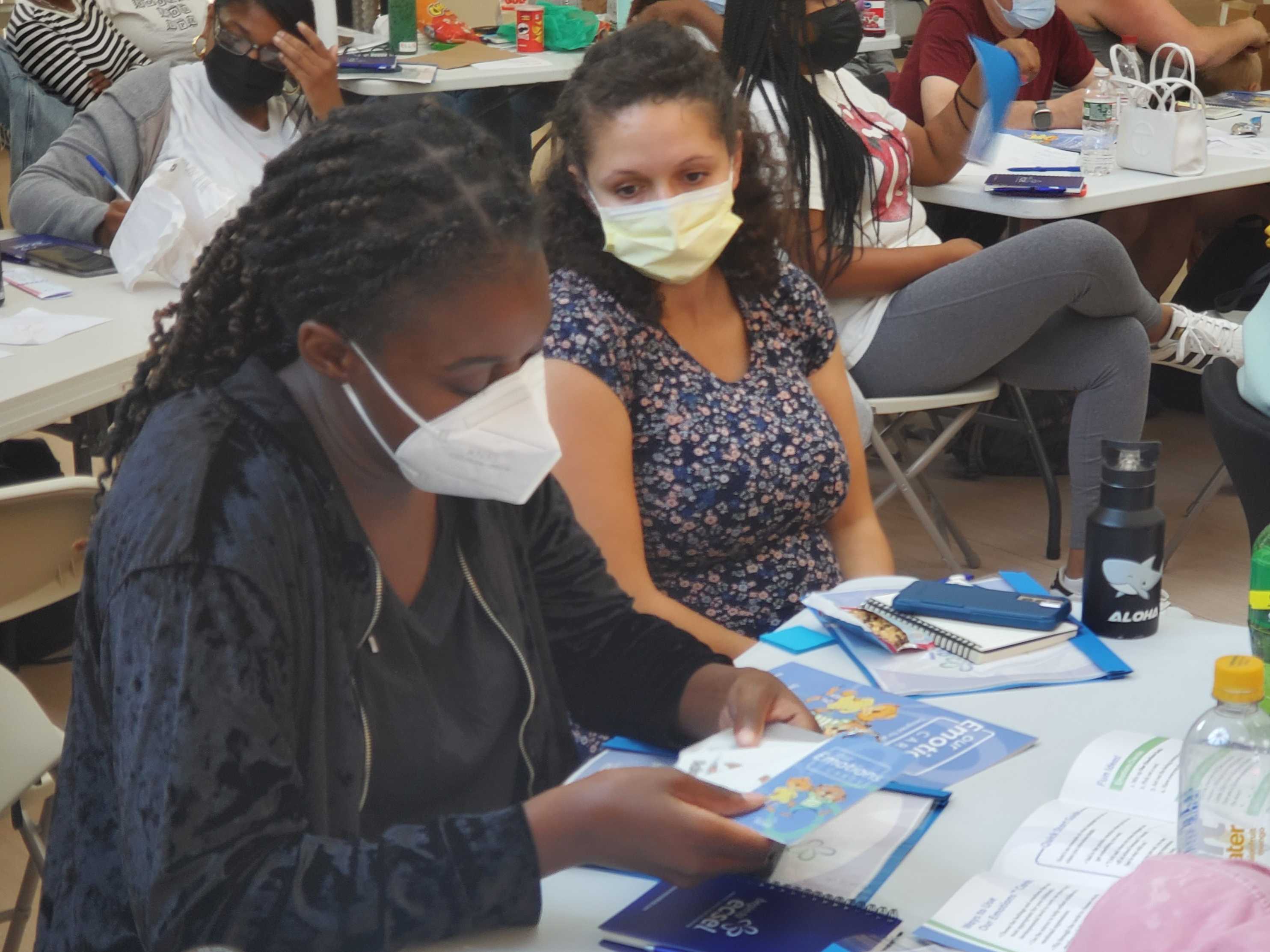 Ellis teachers reading Our Emotions Cards at the orientation